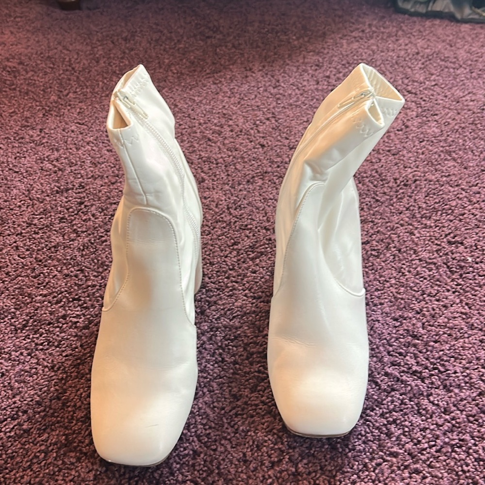 Worn white booties